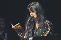 Joy Harjo reads from one of her 13 published books of poetry, “The Woman Who Fell From the Sky,” at the Strater Theater on Feb., 14, 2015 in Durango, Colo. 