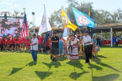 Southern Ute Veteran, Rudley Weaver carries the Southern Ute Tribal Flag into the arbor in Fort Duchesne, Utah during the Opening Ceremonies for Tri-Ute Games on Tuesday, July 16.