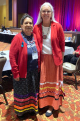 Southern Ute Tribal Chairman, Christine Sage stands with Tribal Councilwoman, Andy Jackson of the Pokagon Band of Potawatomi Indians during a break session of the 14th annual Government to Government Violence Against Women Tribal Consultation on Wednesday, Aug. 21 at the Four Winds Resort in New Buffalo, Mich. The consultation was meant to facilitate an interactive dialogue between Tribal leaders and federal representatives to discuss how to reduce violence against Native American women.
