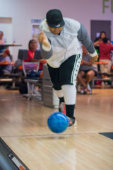 Tamarius Roland rolls his ball down the bowling lane and even adds some extra spin to his ball while competing in the Tri-Ute Games. 