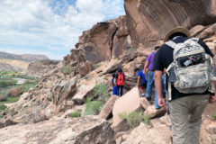 On the first day of field exploration, Ute youth hike a steep path overlooking the Gunnison River to explore four petroglyph panels.