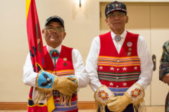 Southern Ute Veteran Association members, Rudley Weaver and Gordon Hammond post the colors and carry in the association’s flag during the opening of the 76th annual NCAI Convention, in Albuquerque, N.M. 