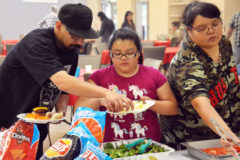 The Pena family enjoys the food provided by the Southern Ute Wellness Court – hamburgers and hotdogs, grilled by Southern Ute Tribal Judge, Scott Moore and Southern Ute Resource officer, Don Folsom, complete with all the fixins’.