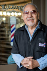 Amador Tucson outside of his barbershop in downtown Durango, Colo., the family run business was established by Tucson in 1972. 