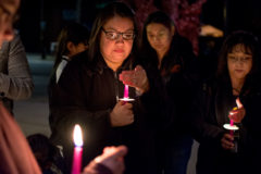 Brandi Archuleta keeps her candle close to keep the flame lit while attending the domestic violence prevention candlelight vigil on Tuesday, Oct. 22 outside the Ignacio Community Library.

