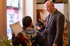 Southern Ute Indian Montessori Elementary teacher, Chris Hofmann leads his students around the Annex Building on Tuesday, Nov. 5 so they can observe all the Egyptian artifacts and deities for a classroom lesson. 