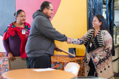 SUIMA’s toddler two teacher, Jared Ruybal accepts a certificate from Southern Ute Chairman, Christine Sage commending him for jumping into action when a student was experiencing a life-threatening situation. 