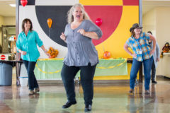 Southern Ute Indian Montessori teachers: Deborah Ochsner, Danielle Burns, Judi  Cole and staff open up the school dance party with their very own coordinated routine on Friday, Nov. 15 in the SUIMA cafeteria.