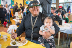 Lawernce “Boo” Cloud and Gia Velasquez sit together and enjoy the special thanksgiving lunch that the Southern Ute Indian Montessori Academy provided on Wednesday, Nov. 20. 