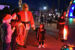 Kids gathered roadside to meet the grinch during the light parade.