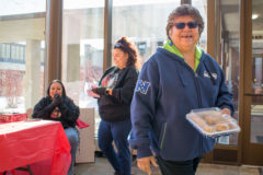 Councilwoman Ramona Eagle leaves the goodie table happy, having purchased homemade cinnamon rolls from the bake sale. The sale was held to bring awareness for Missing and Murdered Indigenous Women and was hosted by the Voices of Our Sisters group, Friday, Jan. 10 in the Leonard C. Burch building’s Hall of Warriors.