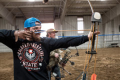 Alex Pena takes aim with a compound bow; both traditional and compound bows are encouraged. 