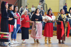 Voices of Our Sisters, including, IHS Girls’ Basketball volunteer assistant coach Maria Rivera (far left) and Lady Bobcat JV/varsity swing player Helaina Taylor (second from left), perform a special Honor Song during the Murdered & Missing Indigenous Women awareness event at the Ignacio High School Bobcats basketball games against Nucla, Saturday, Feb. 1, in the SunUte Community Center.