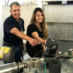 Los Alamos National Laboratory Health Physicist, Mike Duran helps Alejandra Loya-Munoz with surveying a dose-rate meter at the Spectrometer of Materials Research.  