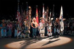 10 Years Ago: Lights dimmed in the Denver Coliseum during the Saturday night Grand Entry as attendees celebrated tribal veterans with an Honor Song. The ceremony was repeated five times over three days at the Denver March Powwow. Thousands of representatives from tribes across the United States convened at the annual event to participate in traditional dance, song, storytelling and other activities.
This photo first appeared in the March 12, 2010, edition of The Southern Ute Drum.