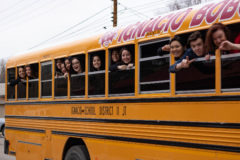  Ignacio Lady Bobcat’s coach, Justa Whitt leans out the side of the bus with her team as they leave the Ignacio High School to make their way to the Colorado State tournament on Wednesday, March 12. 