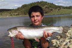 10-year old Phillip Velasquez with a beautiful Rainbow trout he caught at Lake Capote recently. The rainbow measured 24-inches long, 13-inches around the girth and weighed approximately 5 to 6 pounds. He used a fly to hook up with this tank! His favorite saying is, “Let It Fly!
