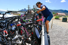 K’ia Whiteskunk, The Ute Mountain Ute Recreation Director helps unload bikes that were delivered by Ignacio Mutual Aid and program co-founder Precious Collins on May 28 to the Ute Mountain Ute Reservation to help the youth engage in outdoor activities.