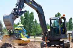 With crucial infrastructure already in place, Weeminuche Construction Authority, out of Towaoc, Colo., prep utility access for the new skate park, Wednesday, June 17.