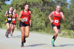 Ignacio Lady Bobcats Charlize Valdez (38) and Maci Barnes (32) run in tandem during the early stages of the 2nd Annual Boggy Draw Bear Chase Friday evening, Aug. 21.  Barnes, a newcomer to the program, would place a team-best sixth overall; Valdez, the race’s defending champion, would finish 14th.
