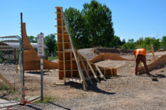 Artisan Skateparks workers begin building forms for the vertical wall that will be a main feature of the skatepark located within the SunUte Park east of the community center.