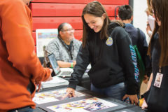 Sierra Red plays “Spot the Difference” at the Southern Ute Drum’s booth, set up for the annual Career Fair at the Ignacio High School on Wednesday, Oct. 23, 2019.