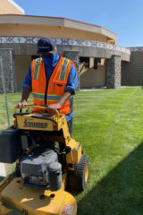 Damitre Burch operating one of the mowers while working with Grounds Maintenance this summer in the Youth Employment Program; students were able to work during the pandemic in a limited capacity, while keeping safety a top priority. 