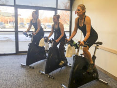  

Fitness instructors, Katy Guffey (left), Erin Cummins-Roper, Heather Riley 

lead a cycling workout class at a SunUte Community Center quarterly event in Ignacio, pre-pandemic. 

 