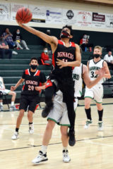 Ignacio’s Jawadin Corona (11) leaps ahead of non-league Sanford’s Ethan Larsen for a breakaway layup during the Bobcats’ Jan. 30 season-opener away. Ranked No. 8 in the preseason CHSAANow.com poll going in, IHS fell 53-48 to then-No. 5 SHS – their would-have-been opponent in the COVID-terminated 2020 Class 2A State Championships’ consolation semifinals.