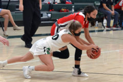 Ignacio’s Avaleena Nanaeto fights Sanford’s Riley Canty (20) for a loose ball during season-opening road action Sat., Jan. 30.  Ranked No. 7 in the preseason CHSAANow.com Class 2A poll going in, the injury-wracked Lady ’Cats fell 51-41 to then-No. 3 SHS.