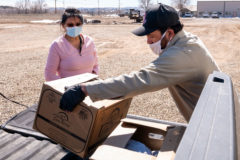Phillip Carrillo, Agriculture Field Technician helps Southern Ute Councilwoman, Vanessa Torres load a USDA food box into her vehicle on Friday, February 28 at the Southern Ute Agriculture Division.  

 