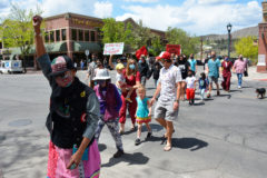 Tisa Bernally-Russell of Farmington, N.M. raises her fist in support for the Murdered and Missing Indigenous Relatives, during the Walk in Solidarity on Main Street in Durango, Colo.