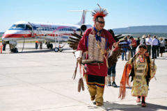 10 Years Ago: Southern Ute tribal member and heritage dancer Alexandra Roubideaux walks off the tarmac at the Durango-La Plata County Airport in the company of her father, Michael, following a dance performance in honor of American Airline’s inaugural flight into town on Thursday, June 9. The airline now offers direct flights to and from Dallas. 
This photo was first published in the June 17, 2011, issue of The Southern Ute Drum.