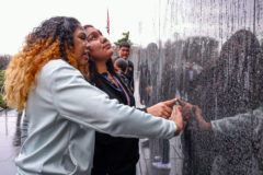 Lexy Young and Kalynn Weaver trace outlines of faces and names that are etched into the Korean War Veterans Memorial on the National Mall. Southern Ute Drum
Reporter/Photographer, McKayla Lee won second place in
the Best Feature Photo category of the 2021 NAJA Awards.