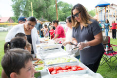 Boys and Girls Club of the Southern Ute Indian Tribe, Board of Director’s Treasurer, Oolcu Buckskin helps serve food during the Club’s annual “End of Summer” barbeque on Friday, August 9, 2019 at Shoshone Park. 
