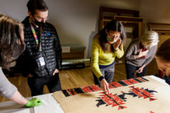 During the initial curatorial consultation, John Lukavic, Andrew W. Mellon curator of Native arts, and Dakota Hoska, assistant curator of Native arts, joined Sarah Melching, Allison McCloskey, and Marina Hays from the Denver Art Museum conservation department to examine a selection of the Acoma Pueblo Textiles that will receive conservation treatment. 