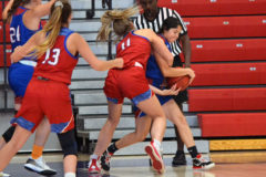 Suiting up for the 2021 Colorado High School Coaches Association All-State Games' Girls' Basketball Blue team, graduated Ignacio senior Charlize Valdez tries ripping the ball away from Red's Alexa Barkeen (5A Castle Rock Castle View) during the third-place game Friday, July 2, inside CSU-Pueblo's Massari Arena.