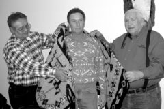 Former Media Manager of The Southern Ute Drum, David Brown receives a Pendleton blanket from Executive Officer, Byron Red and Acting Tribal Information Services Director, Larry Tucker. A dinner was held for Mr. Brown on March 30, 2006 at the Ouray Room. Brown worked for the Southern Ute Tribe for eight years and decided to leave the organization to pursue other interests. Photo published April 14, 2006. 