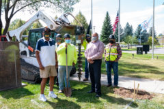 Southern Ute Veterans Association Commander, Howard Richards Sr. and Association Secretary, Bruce LeClaire stand with Construction Services crew members as they make the first changes to the Veterans Park. The goal for the park is to add new benches and picnic tables that will allow for more guest seating during events held in the park.  