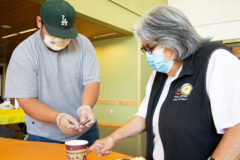 Events and Heritage Coordinator, Jack Frost III helps aid Southern Ute tribal elder, Pearl Casias with her breakfast, which was provided by the Southern Ute Culture Department. The Culture Department hopes to make this event a monthly occurrence as it was requested by the tribal membership.  

 