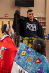 Southern Ute Culture Department’s Heritage and Events Coordinator, Marvin Pinnecoose teaches young girls how to fancy shawl dance during the Cultural Dance Class on Wednesday, September 15. Dance classes are hosted every Wednesday night and are open to the community at the Multi-Purpose Facility. 