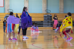 Southern Ute Culture Department dance class instructor, Divine Windyboy teaches young girls how to powwow fancy shawl dance on Wednesday, Oct. 13 inside the SunUte Community Center gymnasium.  