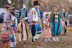 Heritage dancers, Heather White Thunder and Edward Box III share a laugh as they dance together during a round dance at the Durango Public Library. 