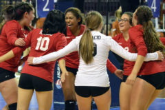 Ignacio's Lexy Young (center) leads the Volleycats in a celebratory shout on Day 1 inside The Broadmoor World Arena in Colorado Springs.
