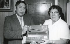 Former Councilwoman Mrs. Edna Hood received an engraved plaque and her old council nameplate from Tribal Chairman Leonard C. Burch at her last meeting on Tribal Council.  