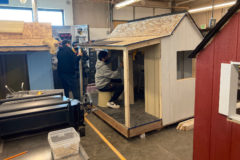 Students  constructing  community  playhouses  for  the  Ignacio High School Wood Manufacturing Program.