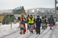 Led by Nathan Strong Elk, Daisy Bluestar and Sinaav Larry (right) who carries his grandfather’s staff, the late Saa-sawnia Hiswaqs (Robert Buckskin), who led the first walks in the early 1990’s – walkers ascend HWY 151 heading north on New Years Day, Jan. 1, 2022.