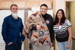 Southern Ute Education Department’s High School Teacher, Damon White Thunder receives a Pendleton blanket from Education Director LaTitia Taylor on Friday, April 1 during a small going away party at the Southern Ute Education building. 