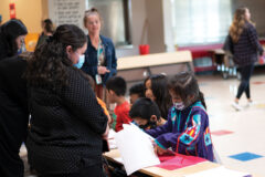 First grade students had the opportunity to share their writing abilities with friends and families at the Writing Celebration event. Ammonie Johnson presents informational stories to his mother, Candi Johnson, Thursday, March 31. 