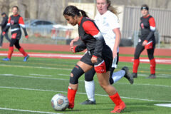 Ignacio senior Angela Baker (4) dribbles the ball to safety away from Bayfield's Emaliah Sawyer during non-league action Wednesday, April 13, at IHS Field.  